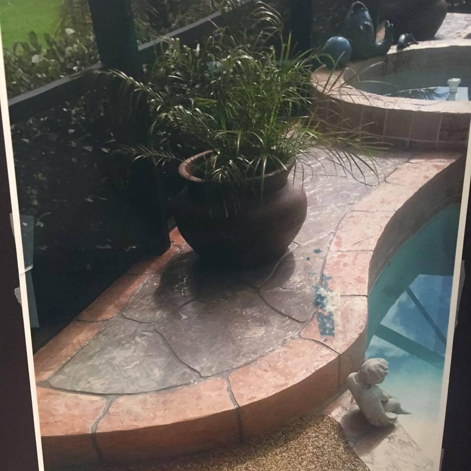 Stamped concrete pool deck with planter